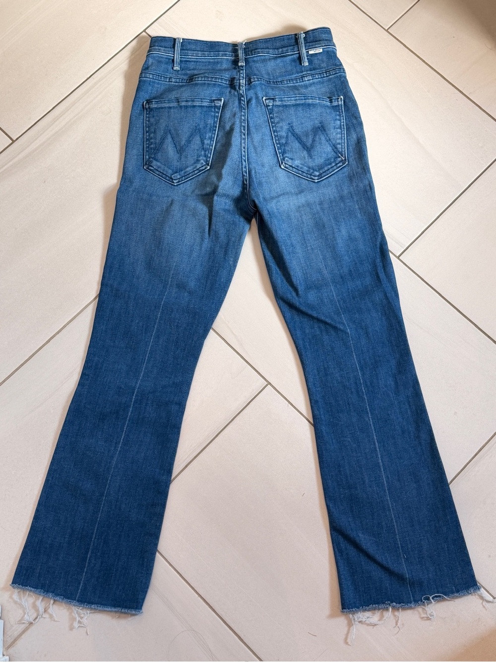 MOTHER Mid-Blue Flare Jeans with Raw Hem